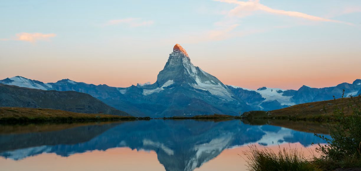 Swiss mountain landscape reflected in a lake